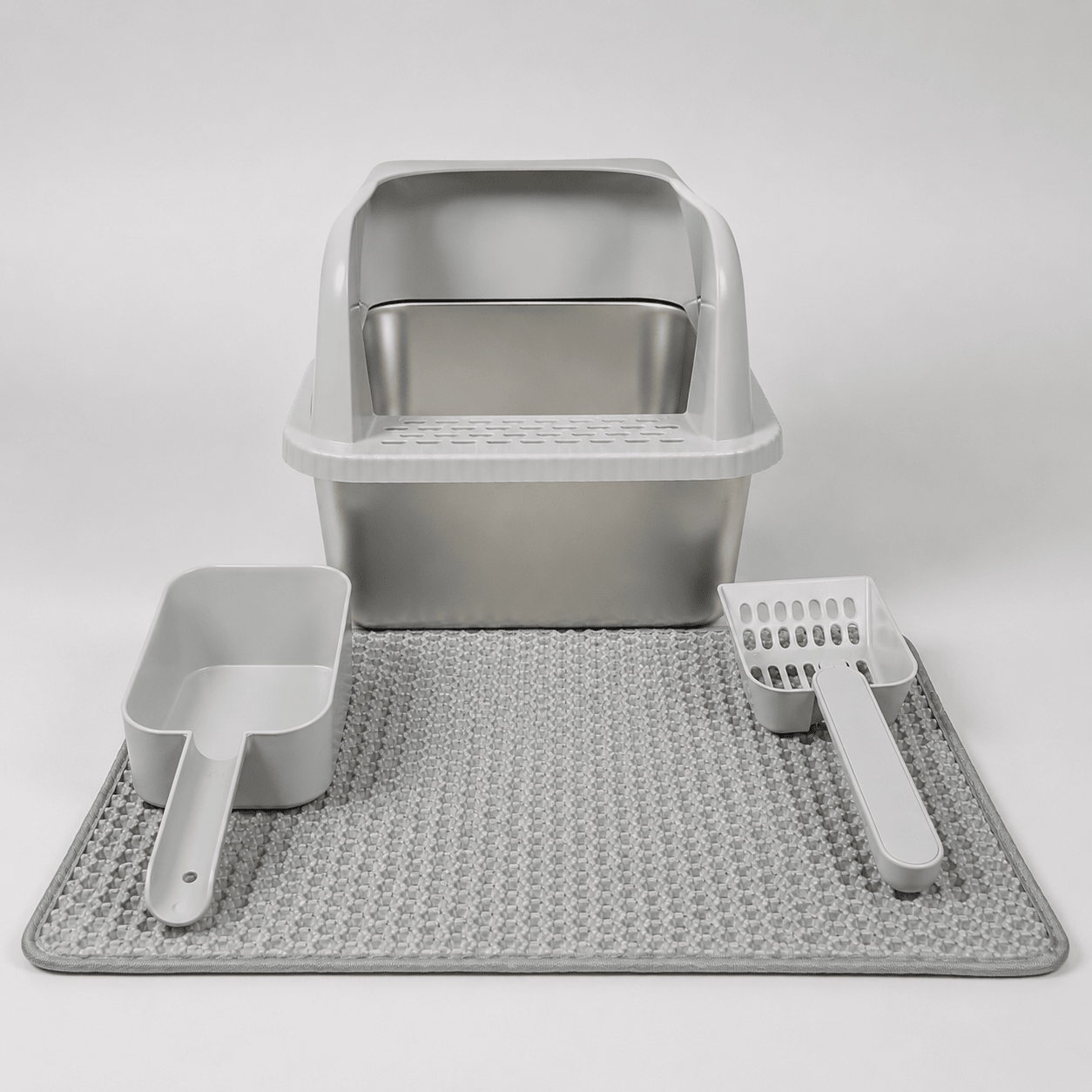 Light gray high-wall cat litter box with scoop, rake, and textured mat