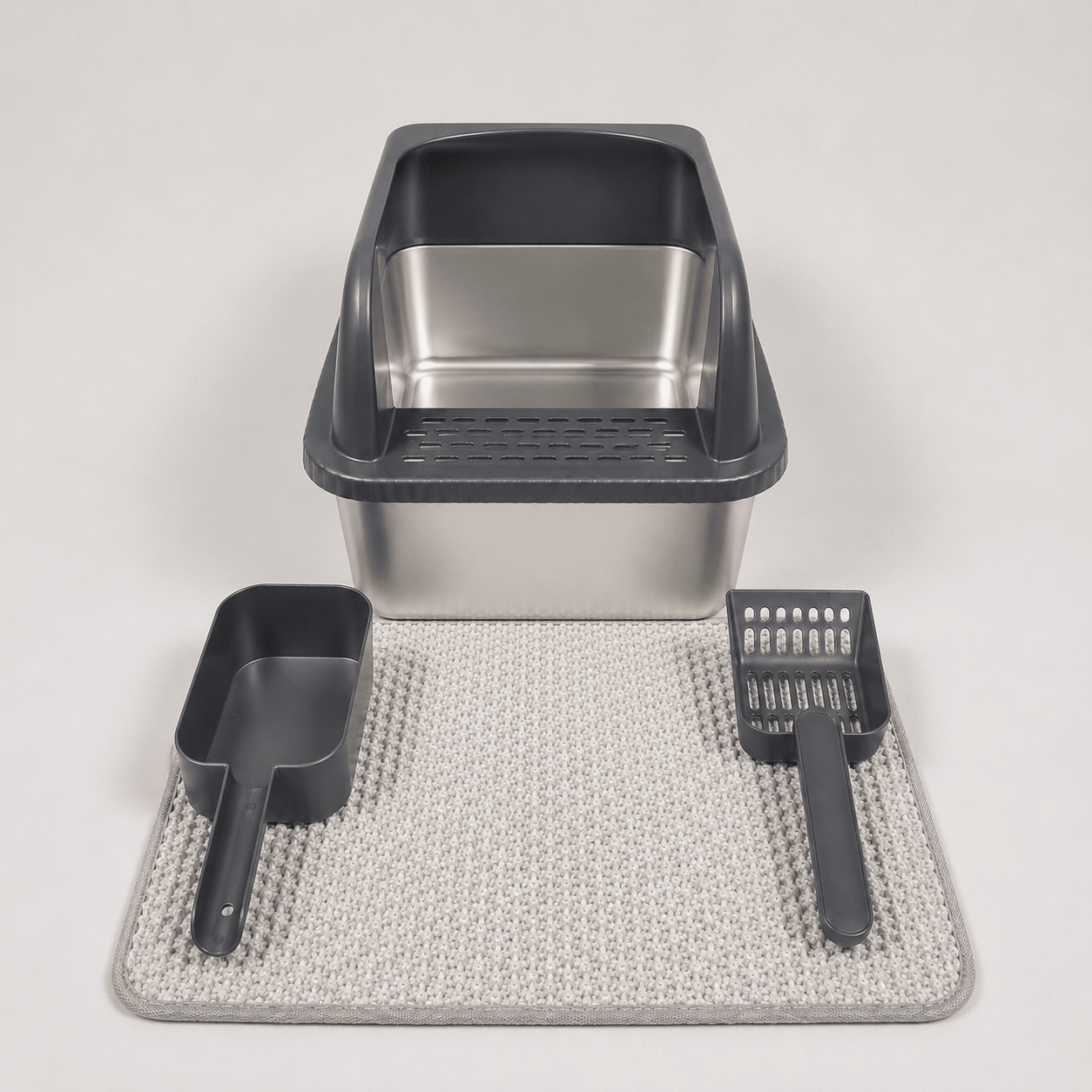Black high-wall cat litter box with scoop and textured anti-slip mat