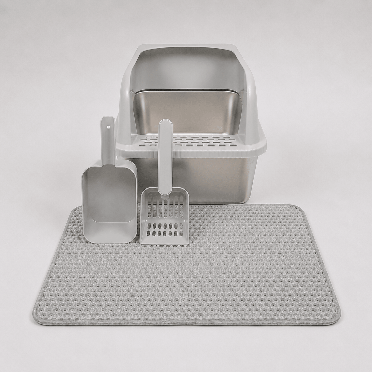 White high-wall cat litter box with scoop, rake, and textured anti-slip mat