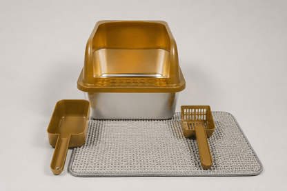 Amber gold high-wall cat litter box with scoop, rake, and textured mat