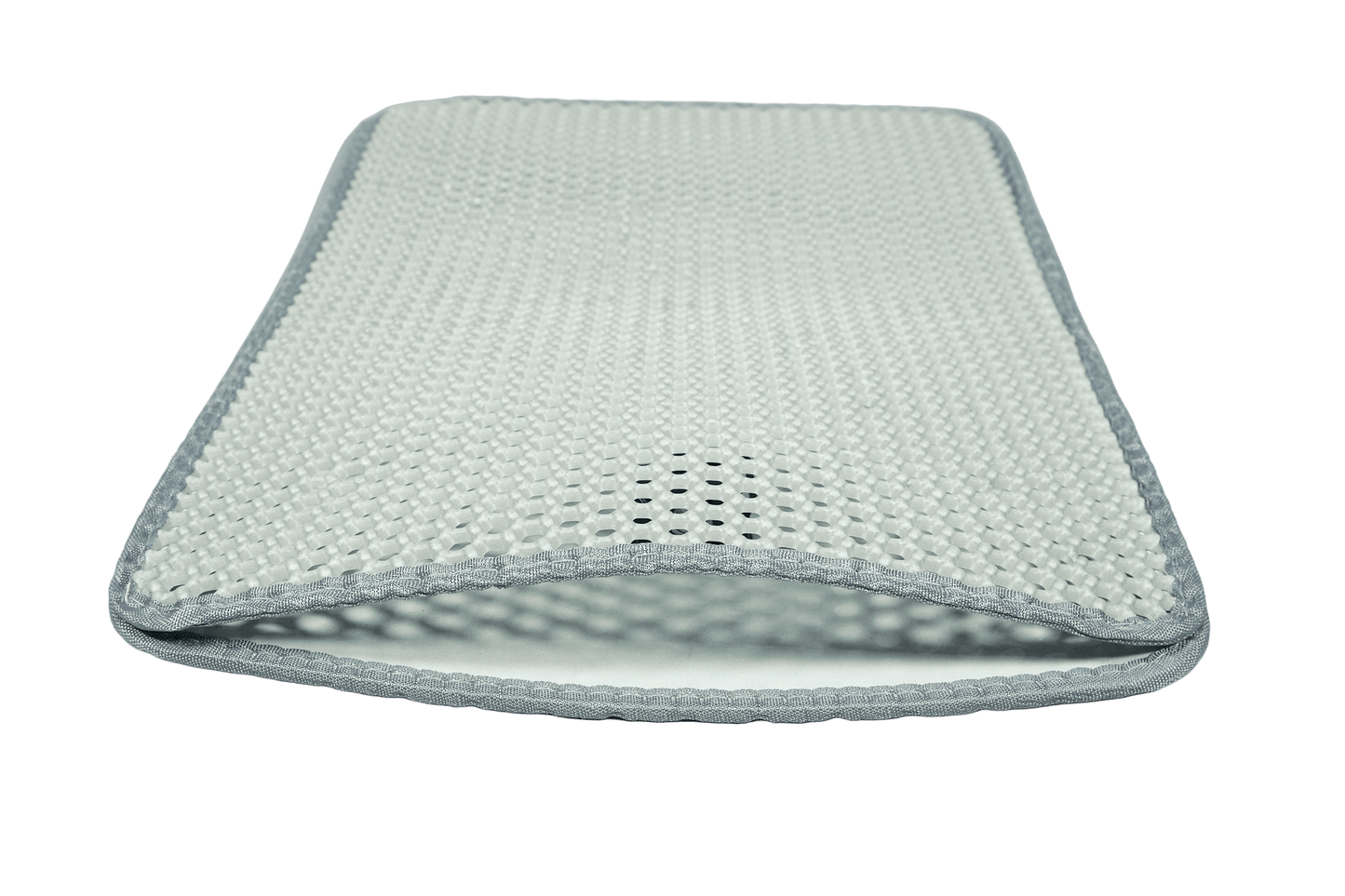 Textured cat litter mat with dark edge trim, designed to catch and trap stray litter.