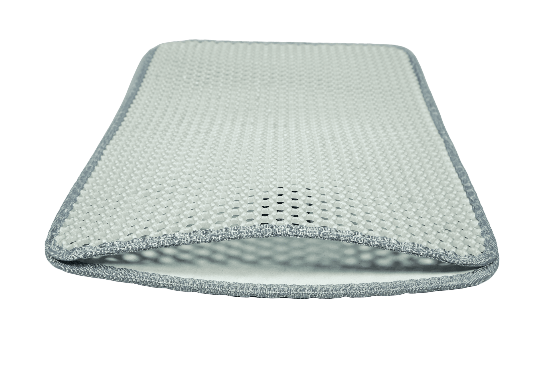Textured cat litter mat with dark edge trim, designed to catch and trap stray litter.
