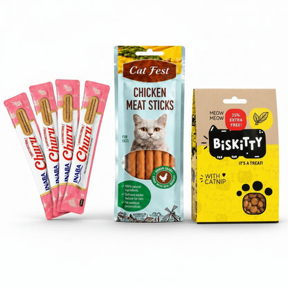 The Bribe Box with four INABA Churu tubes, Cat Fest chicken meat sticks and Biskitty catnip treats on ivory display blocks.