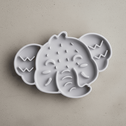 Elephant-shaped silicone slow feeder mat for cat bowls, gray with raised maze bumps