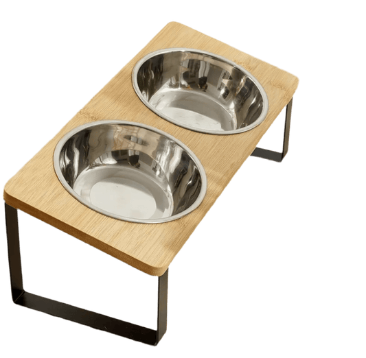 Two stainless steel pet bowls in light wood elevated feeder with black metal frame