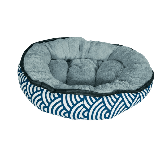 Reversible plush oval kitten bed, light gray inner cushion and blue striped wave exterior