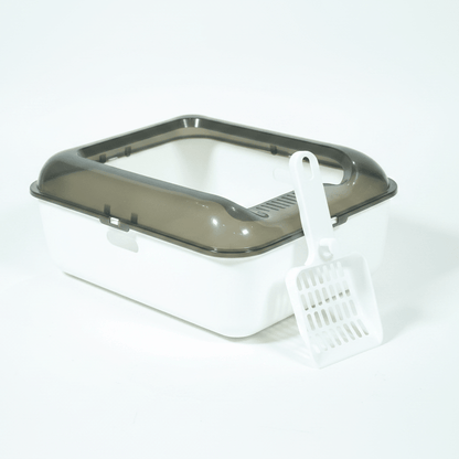 White cat litter box with dark gray lid, scoop on front