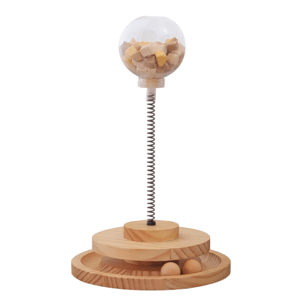 Wooden interactive cat treat dispenser with clear dome and spring base, slow feeder holes