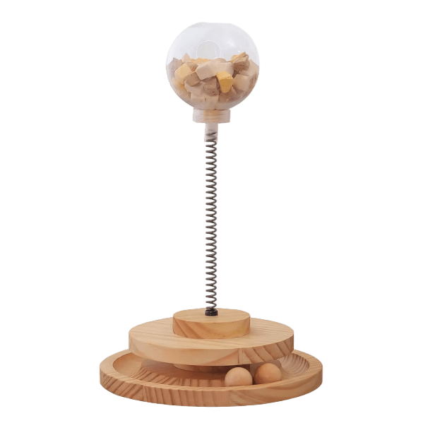 Wooden interactive cat treat dispenser with clear dome and spring base, slow feeder holes