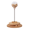 Wooden interactive cat treat dispenser with clear dome and spring base, slow feeder holes