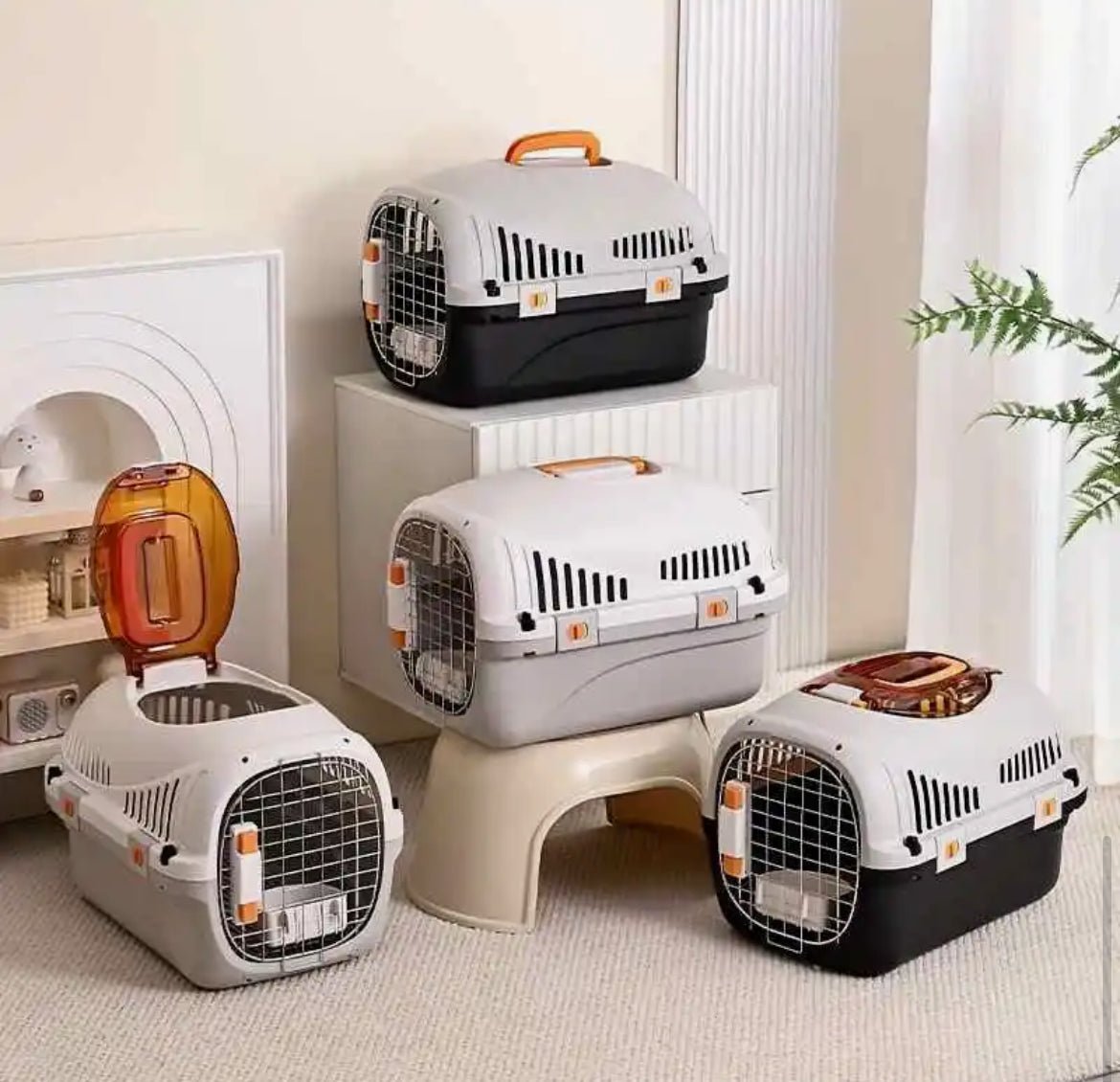 White top-load ventilated cat carrier with metal front grille, shown with three carriers