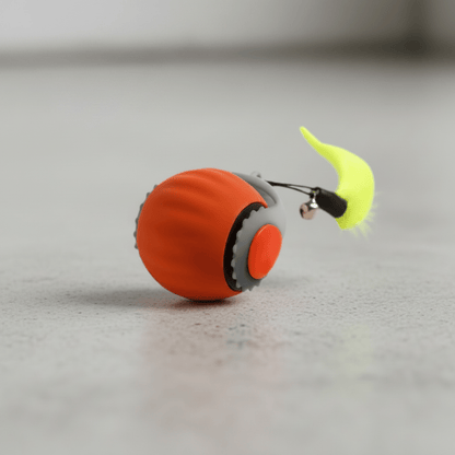 Orange interactive cat toy ball with neon green tail, gray speaker-style end.