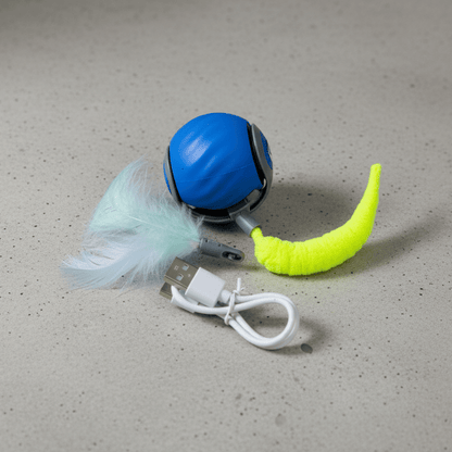 Blue interactive cat toy ball with green tail, white charging cable and feather.